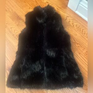 Black fur vest with pockets